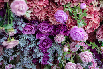Naklejka premium Closeup image of beautiful flowers wall background with amazing colorful roses. Top view