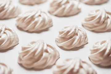 Cooked homemade meringue cookies on baking paper