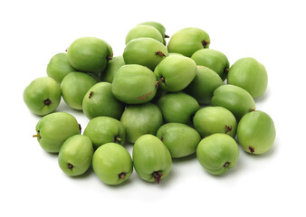 mini kiwi baby fruit (actinidia arguta) on white background 