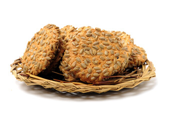 Obraz premium closeup large biscuits with sunflower seeds on white background