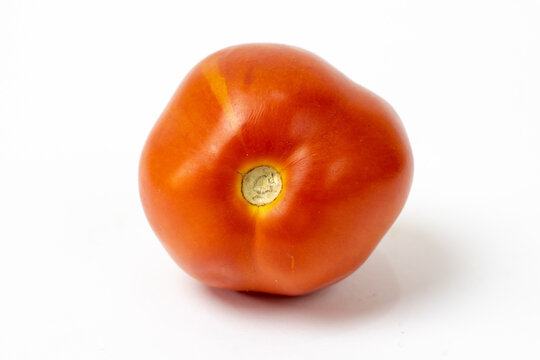 Isolated red tomato close up on white background