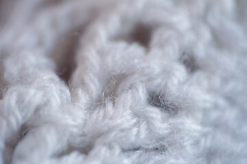 White knitted wool texture. Winter background