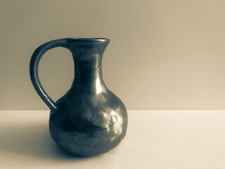 Handmade wrought iron water jug ​​from old times.