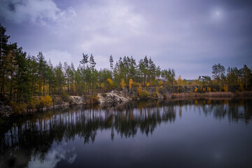 Fototapeta na wymiar lake in autumn and reflection of trees in lake