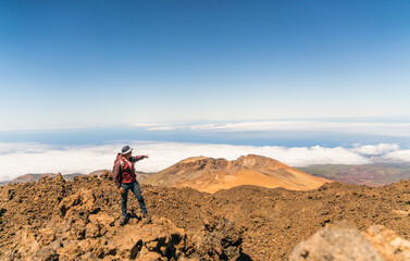 Fototapeta na wymiar hiker in the top of volcano mountains in teide tenerife canary islands