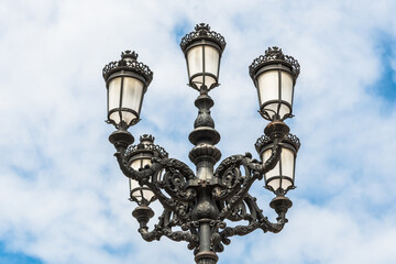 Fototapeta na wymiar Lamppost in the Plaza de Maria Pita in A Coruña, Galicia, Spain