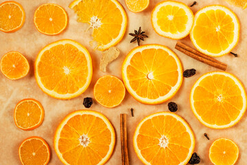 Round orange slices and mulled wine seasoning, warm background.