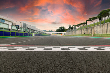 Motor sport circuit asphalt track starting and finish line checkered sign front view scenic sunset...