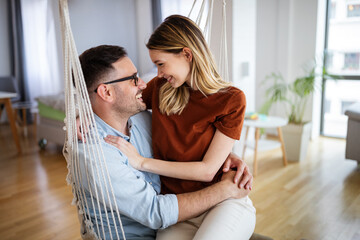 Romantic happy young couple in love relax at modern home and have fun