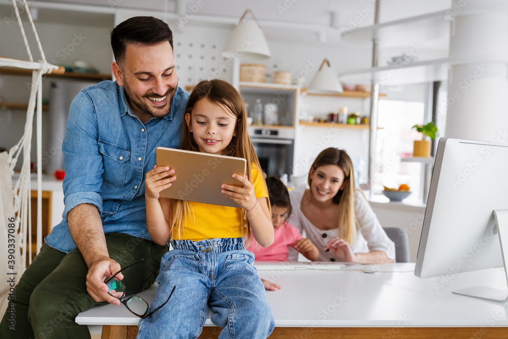 Wall mural Happy family spending time at home and using digital, technology devices.