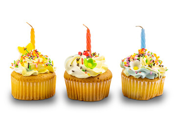 Birthday vanilla cupcake garnished with butter cream frosting decorated with colorful rainbow sprinkles and birth day candle on white background with clipping path.