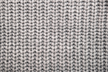 Seamless pattern of knitted warm winter sweater, close-up texture
