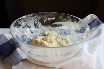 Household. Dough in a large glass baking bowl. Family celebration.