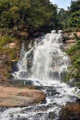 Obraz premium A mountain river is a river that runs usually in mountains, in narrow, deep valley with steep banks, rocky stream bed, and accumulated rock debris.