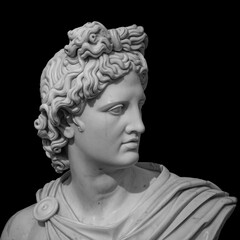 Portrait of a plaster statue of Apollo isolated on black