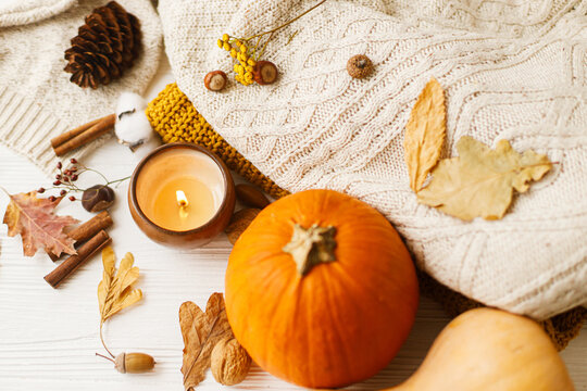 Happy Thanksgiving. Candle, pumpkins, cozy sweaters, autumn leaves, spices, cotton