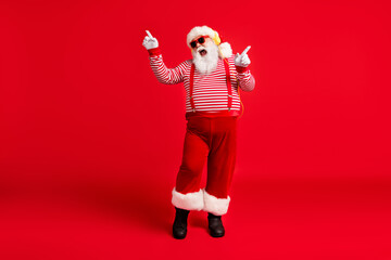 Fototapeta na wymiar Full length body size view of his he handsome bearded fat overweight cheerful glad Santa fan listening single melody dancing having fun rest isolated bright vivid shine vibrant red color background