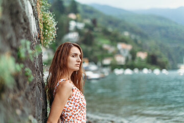 Beautiful girl on the shores of Lake Como