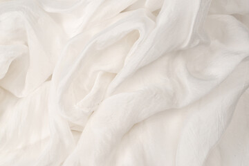 Soft smooth white silk fabric background. Fabric texture.