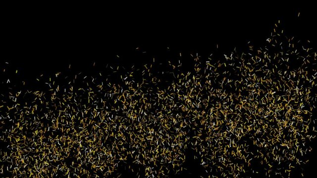 Golden yellow bursts of festive confetti in a sequence from left to right on black background. Digital animation.