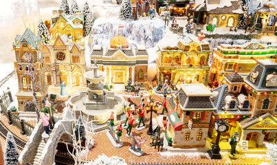 Vintage installation with toy houses for a Christmas composition. Christmas Eve in an old European town. New Year's card depicting old streets in a toy town.