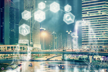 Double exposure of technology theme hologram and cityscape background. Concept of Hightech.