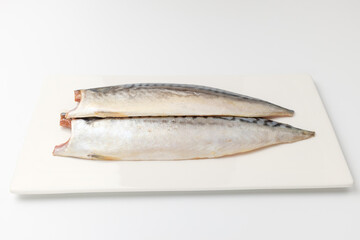 Raw mackerel on a white background
