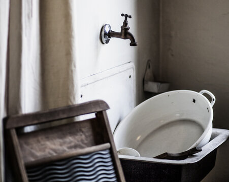 Closeup Shot Of Old Dishes In A Vintage Sink