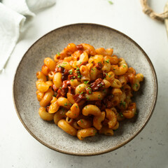 Pasta with tomato sauce and salami