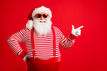Fototapeta na wymiar Portrait of his he nice handsome attractive cheerful bearded fat gray-haired Santa showing copy space bargain decision novelty isolated over bright vivid shine vibrant red color background