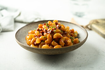Pasta with tomato sauce and salami