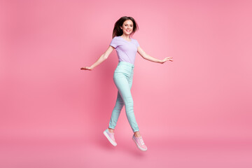 Full size photo of nice cute lovely pretty girl jump enjoy spring weekend wear good look clothes footwear isolated over pink color background