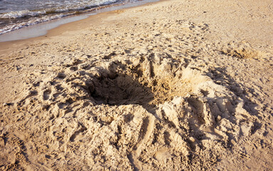 Hole in the sand on the beach