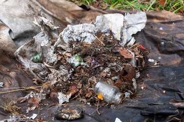 big amount of trash in forest, global environment issues