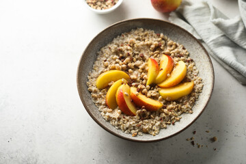 Healthy oatmeal porridge with fresh peach