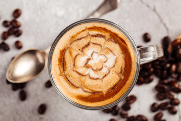 Decorated coffee latte in a glass mug