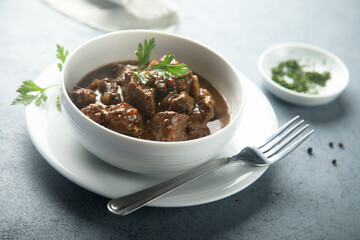 Traditional homemade beef ragout with fresh parsley