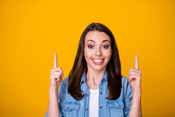 Portrait of cheerful excited girl promoter point up index finger copyspace present adverts...