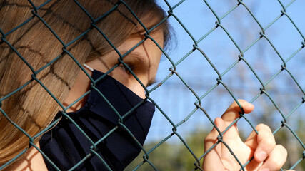 Sad Child Wears Protective Mask due Coronavirus Pandemic, Sick Unhappy Girl, Depressed Kid not...
