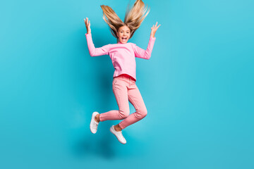 Full size photo of funky cool teenager jump yell hair up wear pink pants poloneck white footwear isolated on teal background