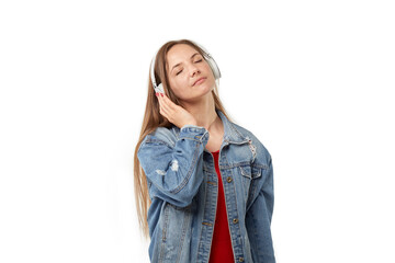 Portrait of a young woman listening to music with headphones with her eyes closed. White isolated background.