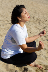 Fototapeta na wymiar Beach girl doing yoga, Lifestyle, Barcelona, Spain.