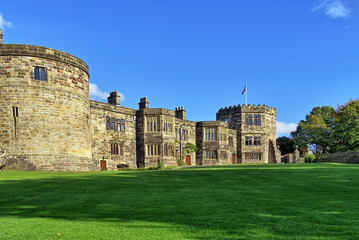 An external view of Skipton Castle and lawns