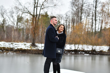 Winter love story. smile, hugs and kiss of a couple in love. romance and love