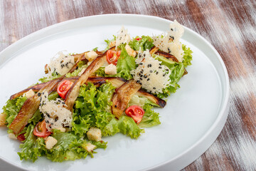 Salad with baked eggplant, mozzarella and romaine lettuce