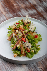 Salad with baked eggplant, mozzarella and romaine lettuce