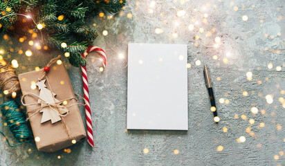 Christmas banner with mockup for text. A note with New Year's plans and goals on a decorated table.