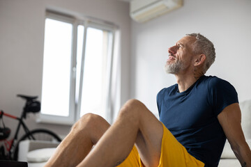 Thoughtful athlete is staring in a distance