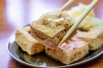 Deep fried stinky tofu with pickled cabbage, famous and delicious street food in Taiwan.