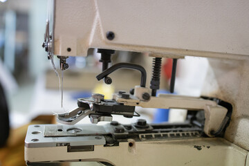 A sewing machine. Concept of equipment for manual work related to professional knowledge and craftsmanship. Selective focus